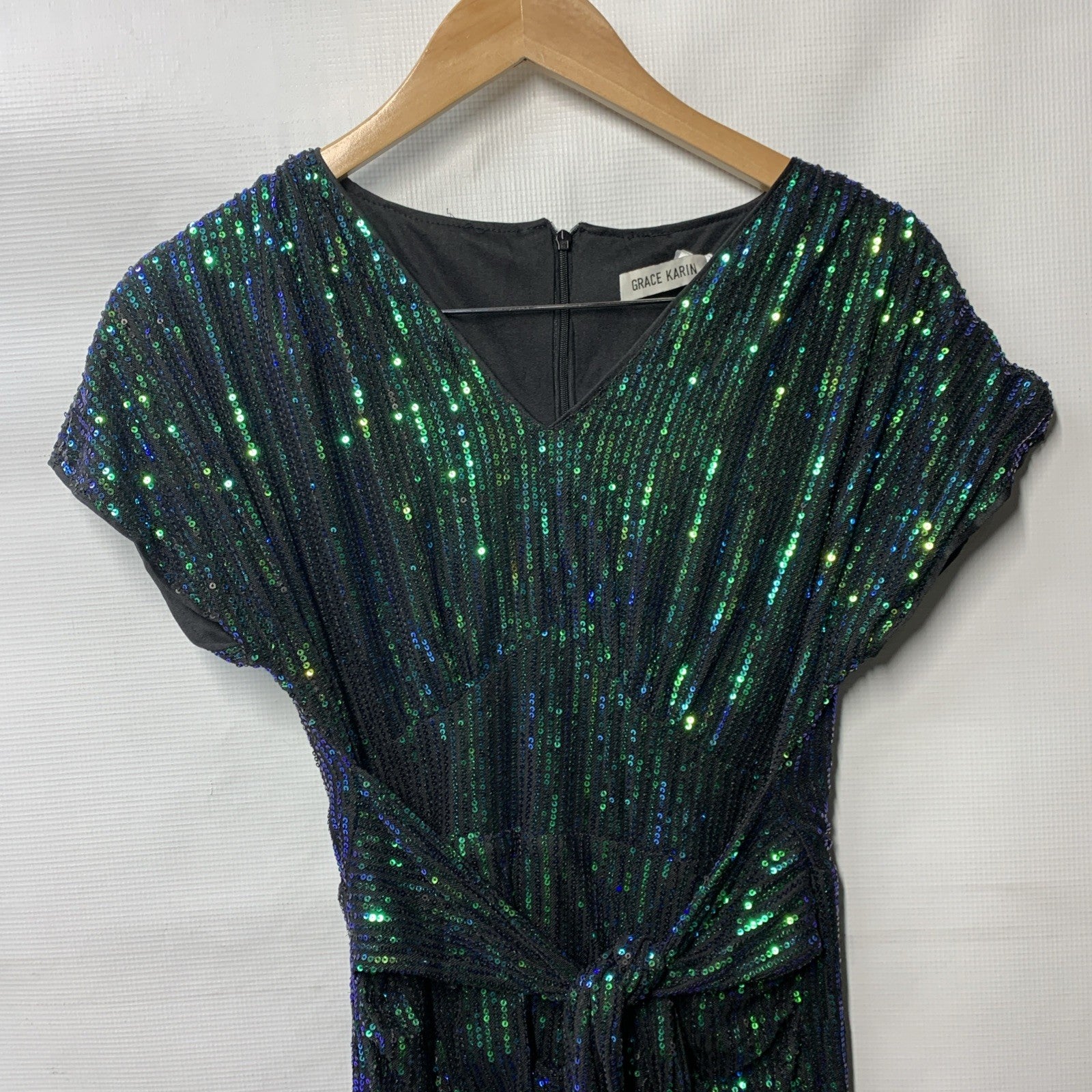 Green Grace Karin bodycon cap sleeve sequin party dress with V-neck, designed for women, size small, stylish and fitted.