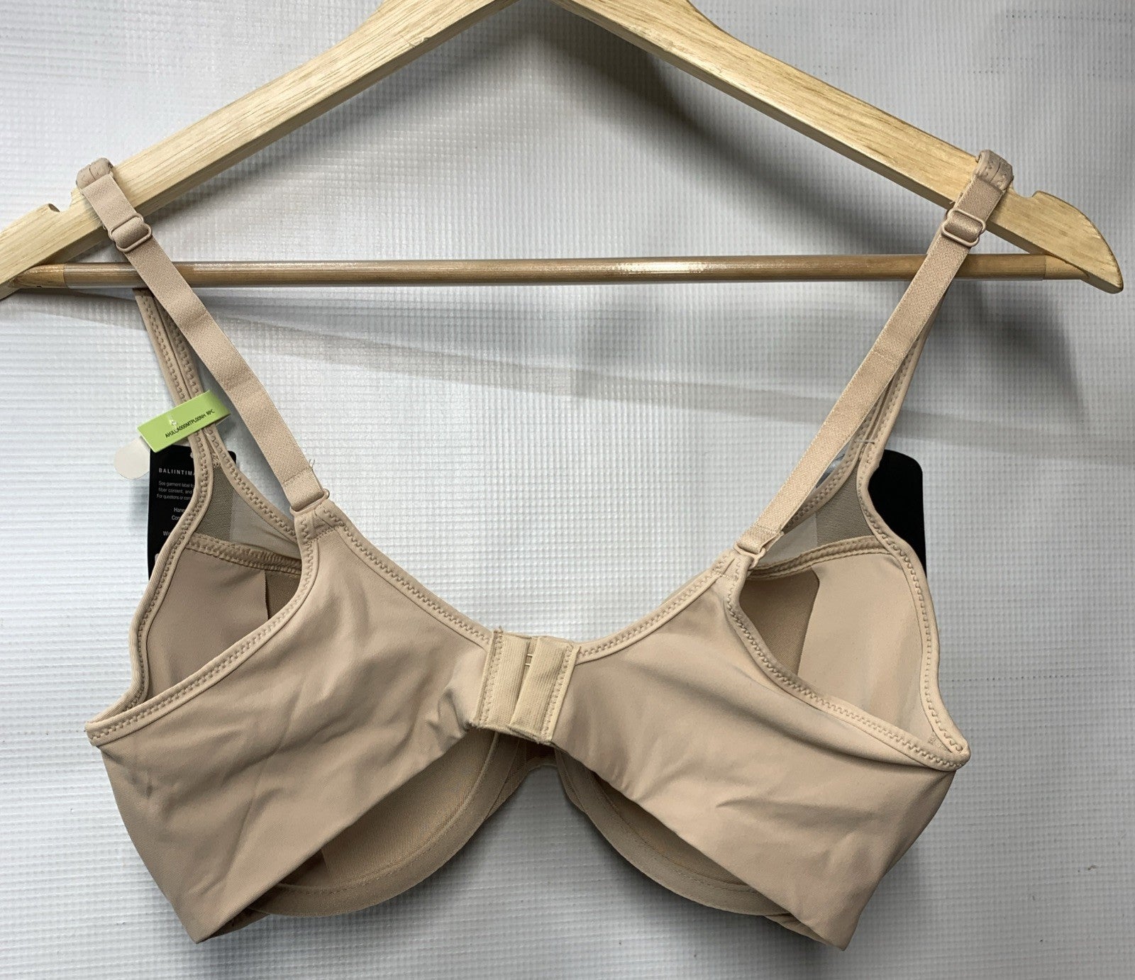 Nude Women's One Smooth U Ultra Light Bra with illusion neckline from The Family Flips, size 36B, showing front detail.