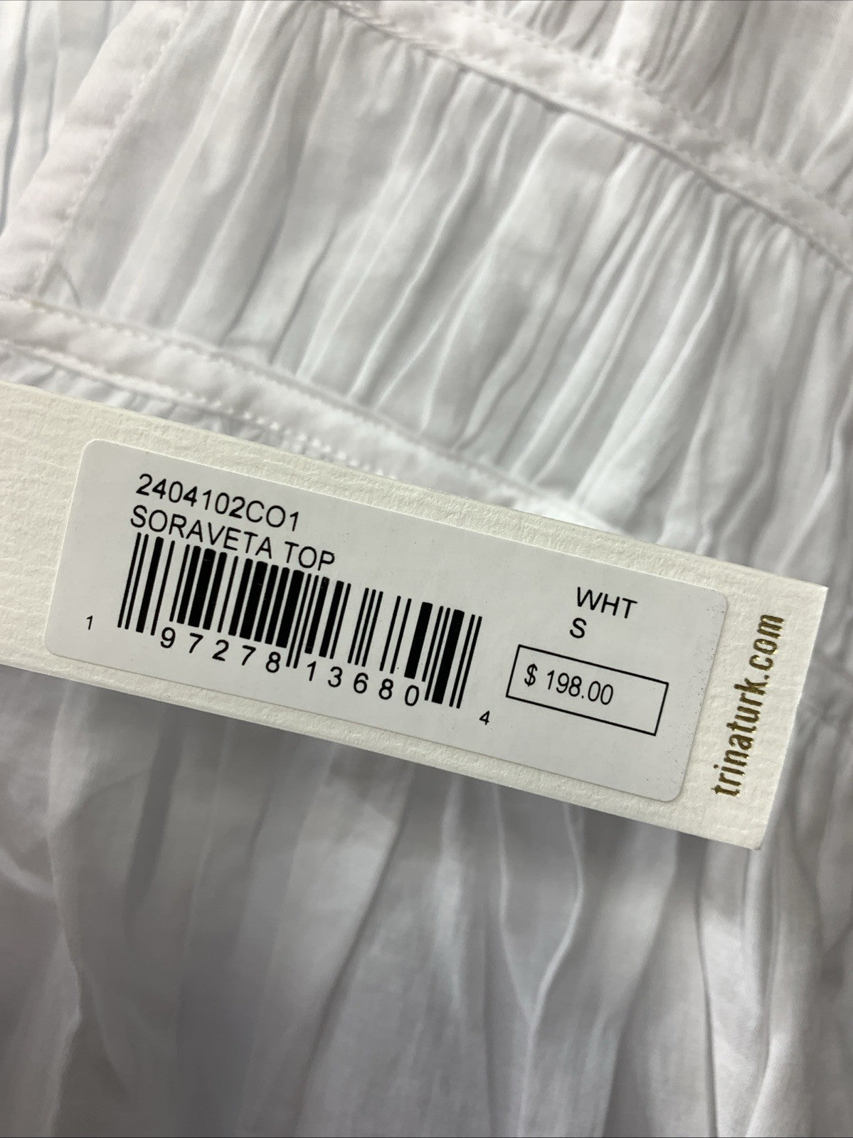 White Trina Turk women's Soraveta sleeveless top with string tie, size small, casual clothing for women.