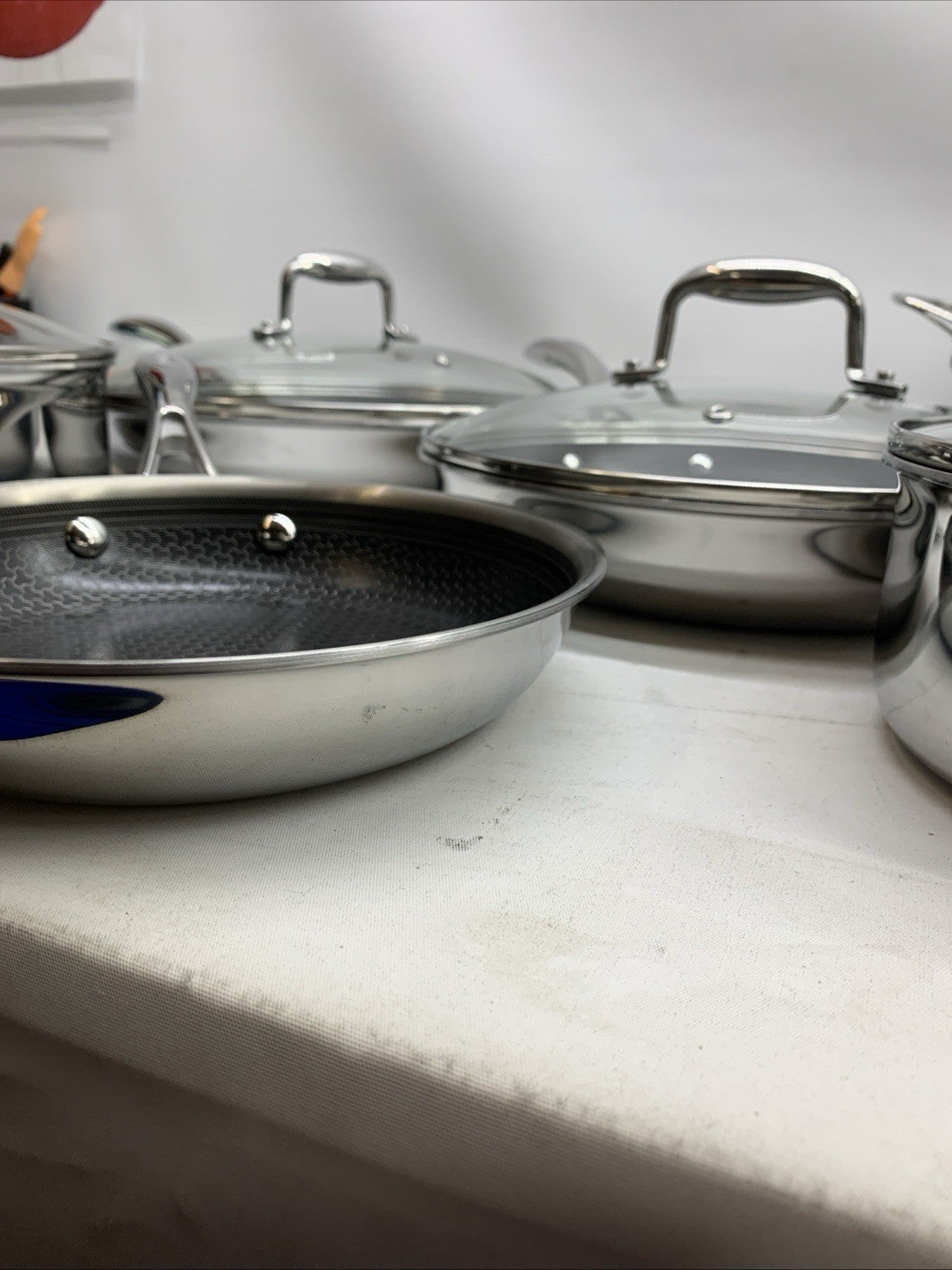 Deluxe 13-piece hybrid ceramic nonstick stainless steel cookware set by The Family Flips, including pots, pans, and lids.