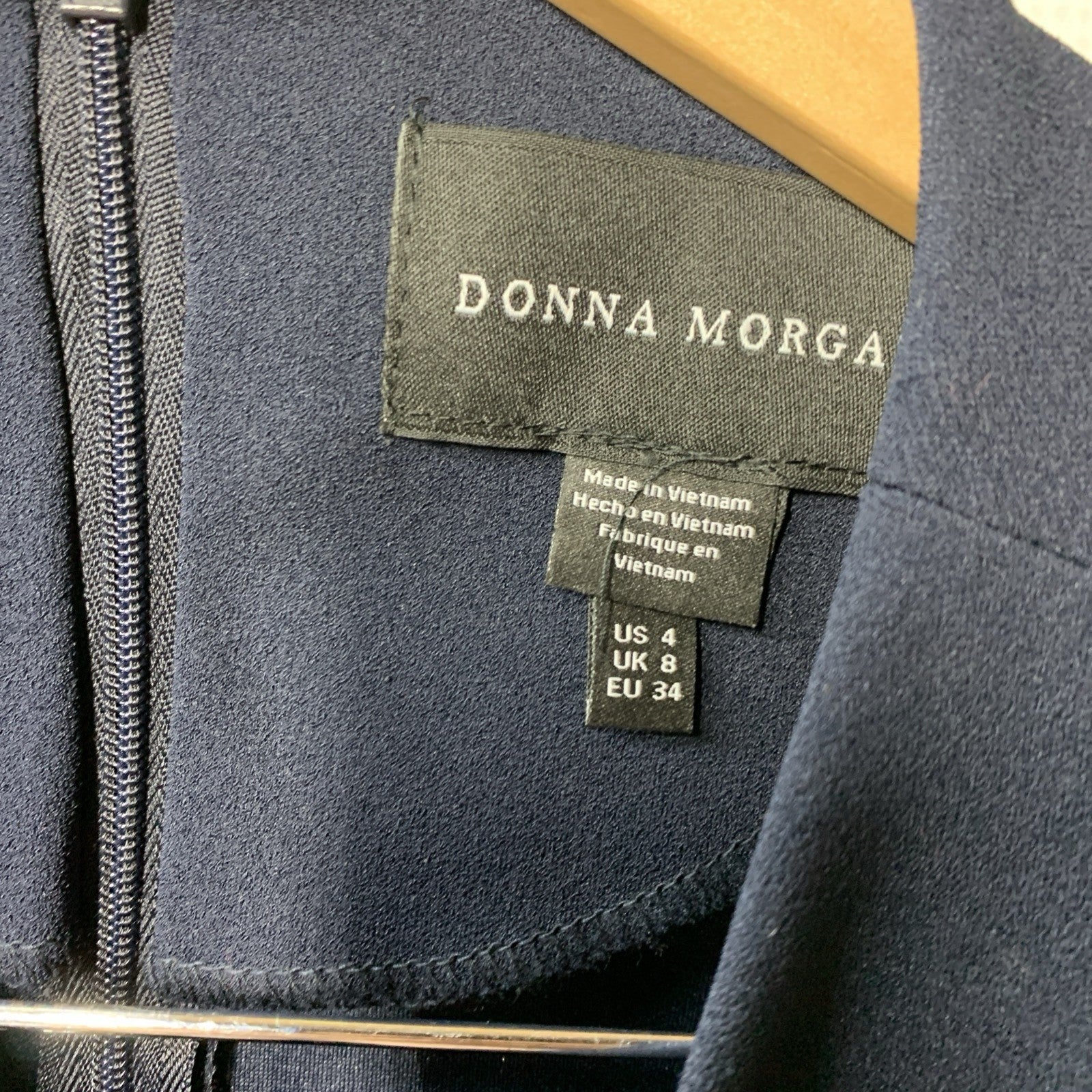 Navy blue Donna Morgan women's long sleeve dress, size 4, suitable for formal or business casual occasions.