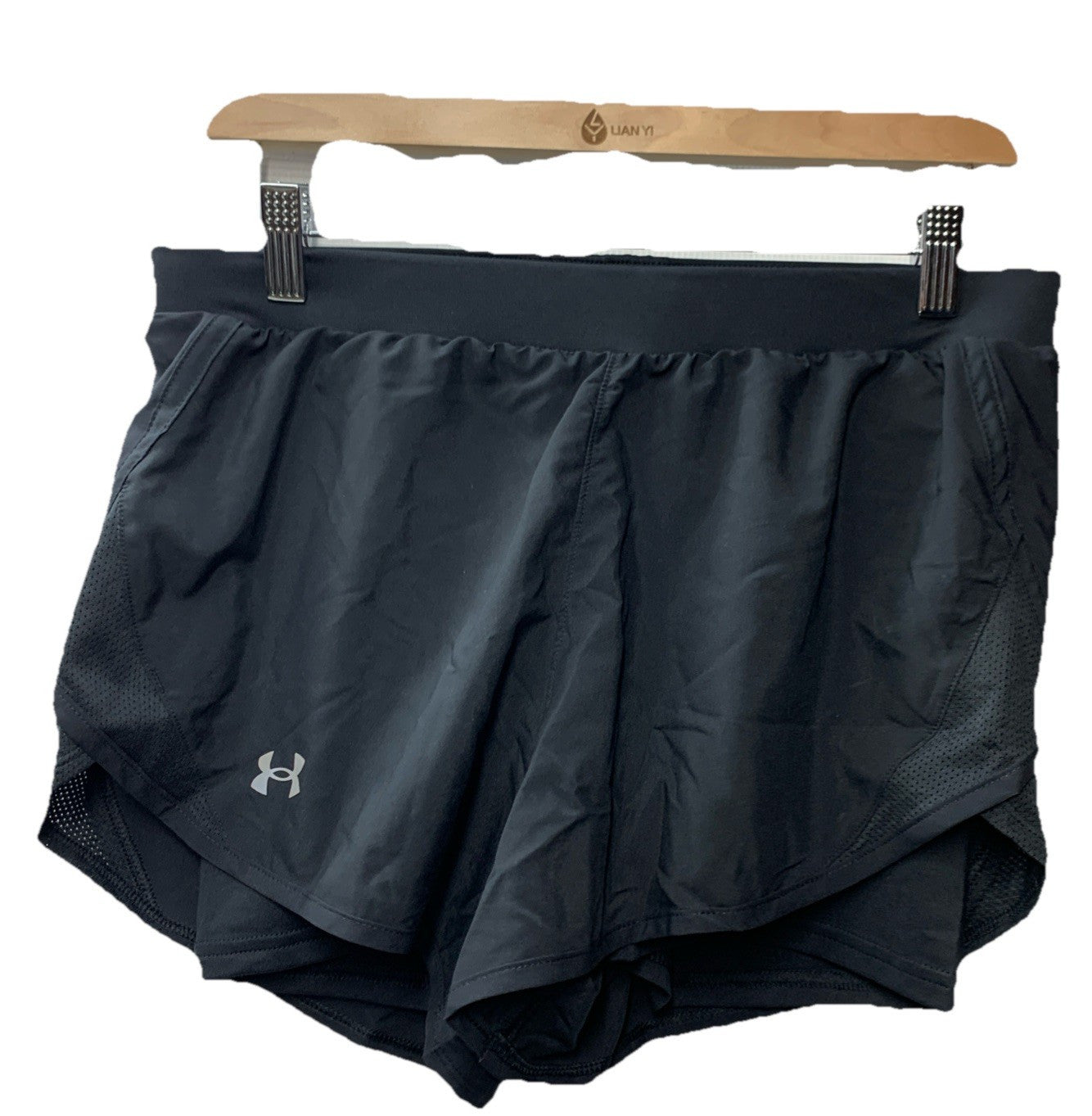 Black Under Armour Fly By 2.0 women's activewear shorts, fitted design, size M, suitable for body building workouts.