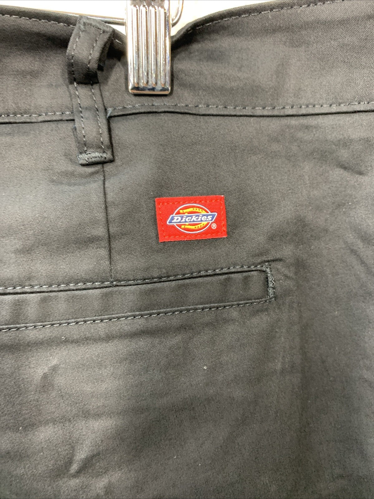 Dickies women's flat front stretch twill long pants in desert black, size 24 regular, featuring a comfortable fit and tailored style.