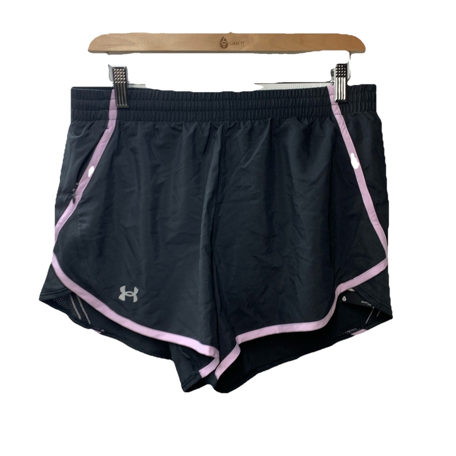 Under Armour women's Fly By lined loose running shorts in black and lavender, size M, featuring lightweight activewear fabric and comfortable fit.