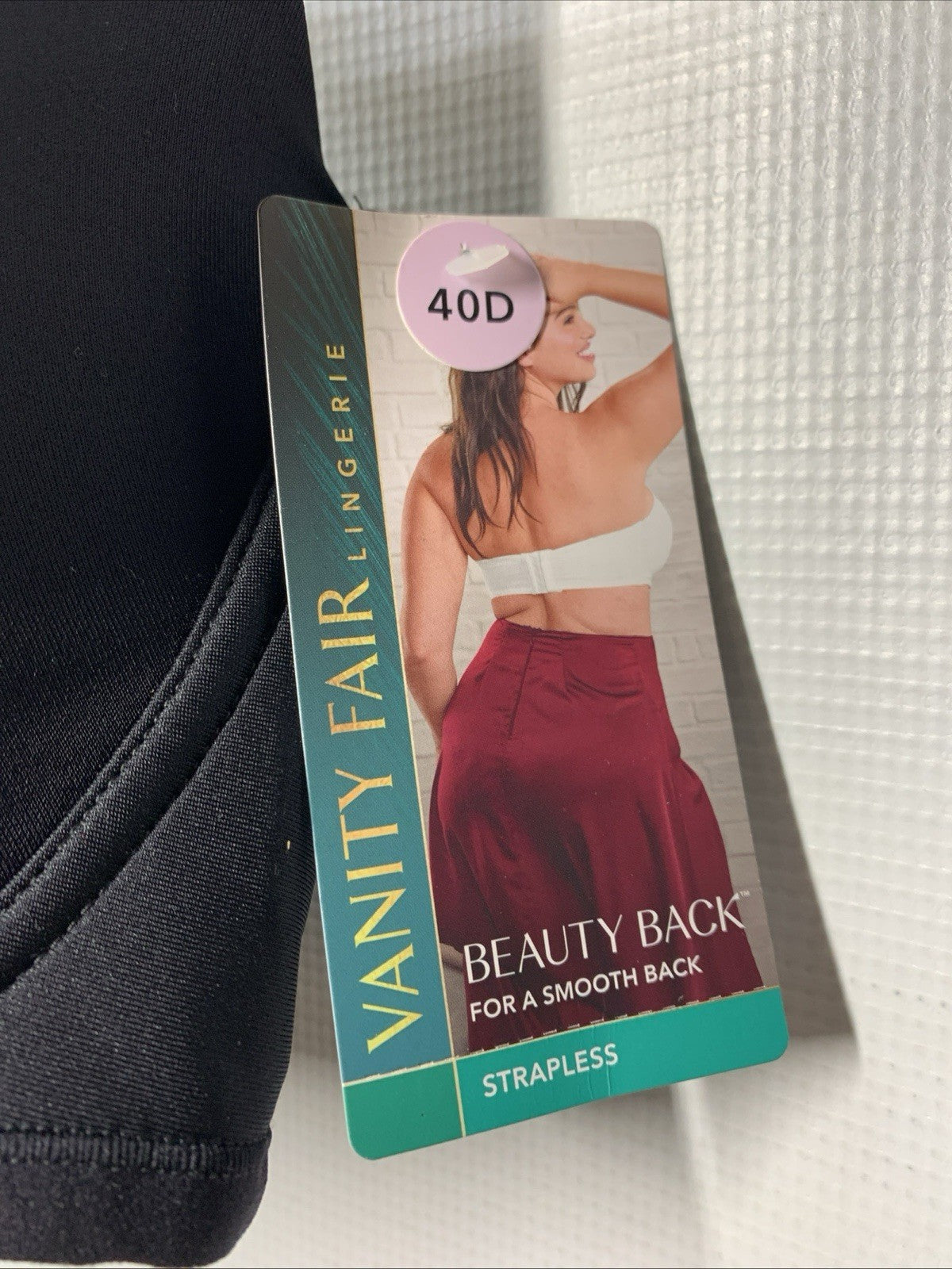 Black Vanity Fair women's strapless underwire bra in size 40D, featuring a smooth back strapless design for seamless wear.