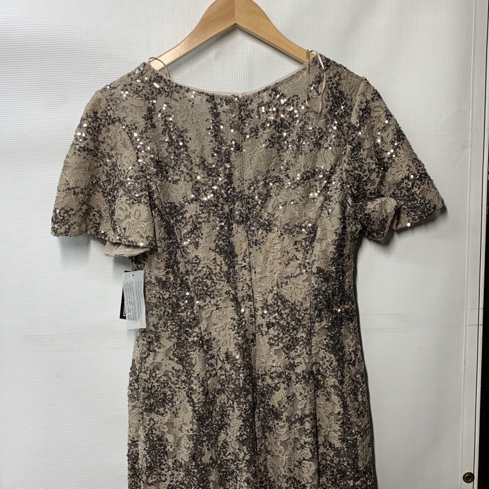 Taupe long rosette mother of the bride dress for women, size 8, by The Family Flips, featuring elegant floral details and flowing fabric.