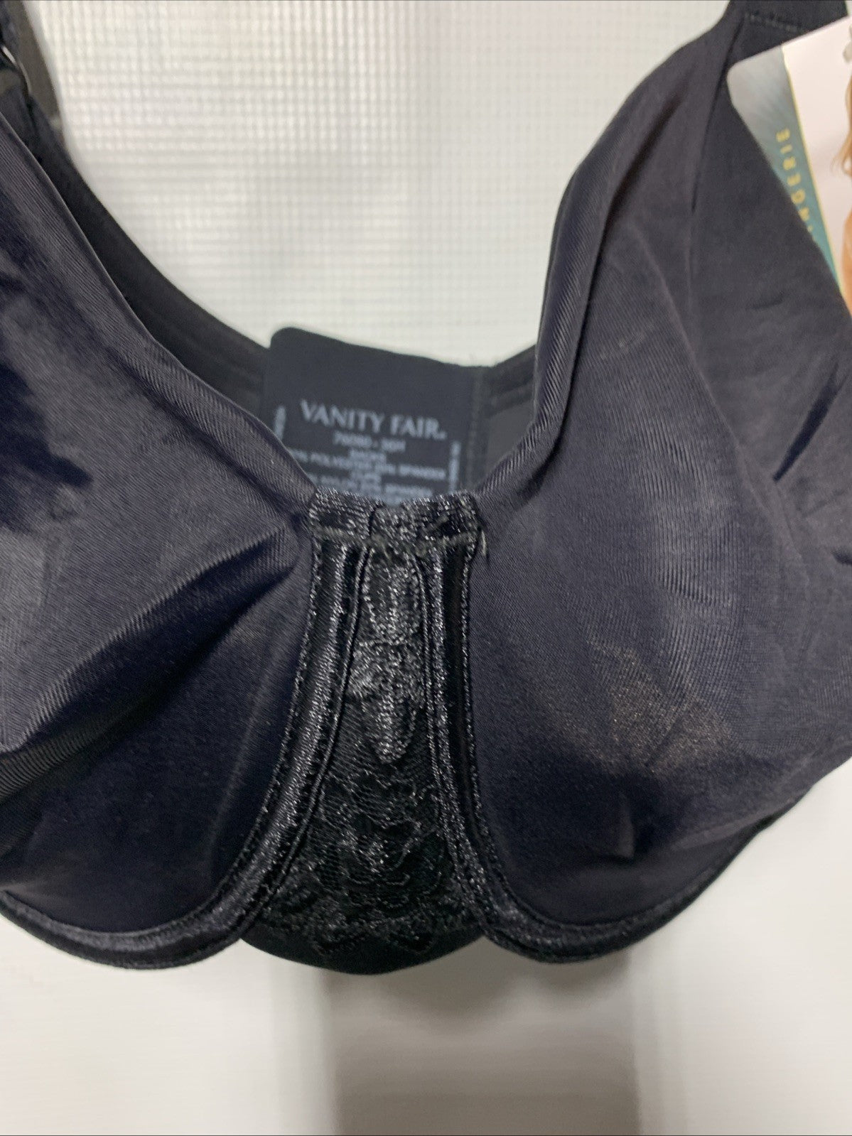 Black Vanity Fair 76080 women's underwire minimizer bra in 36H with back smoothing design, from The Family Flips.
