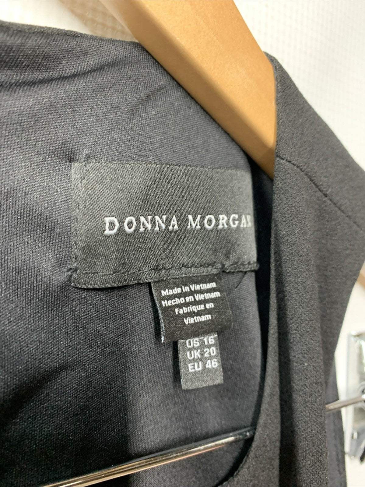 Black Donna Morgan women's sleeveless short dress in size 16, casual party style, shown on a hanger or model.
