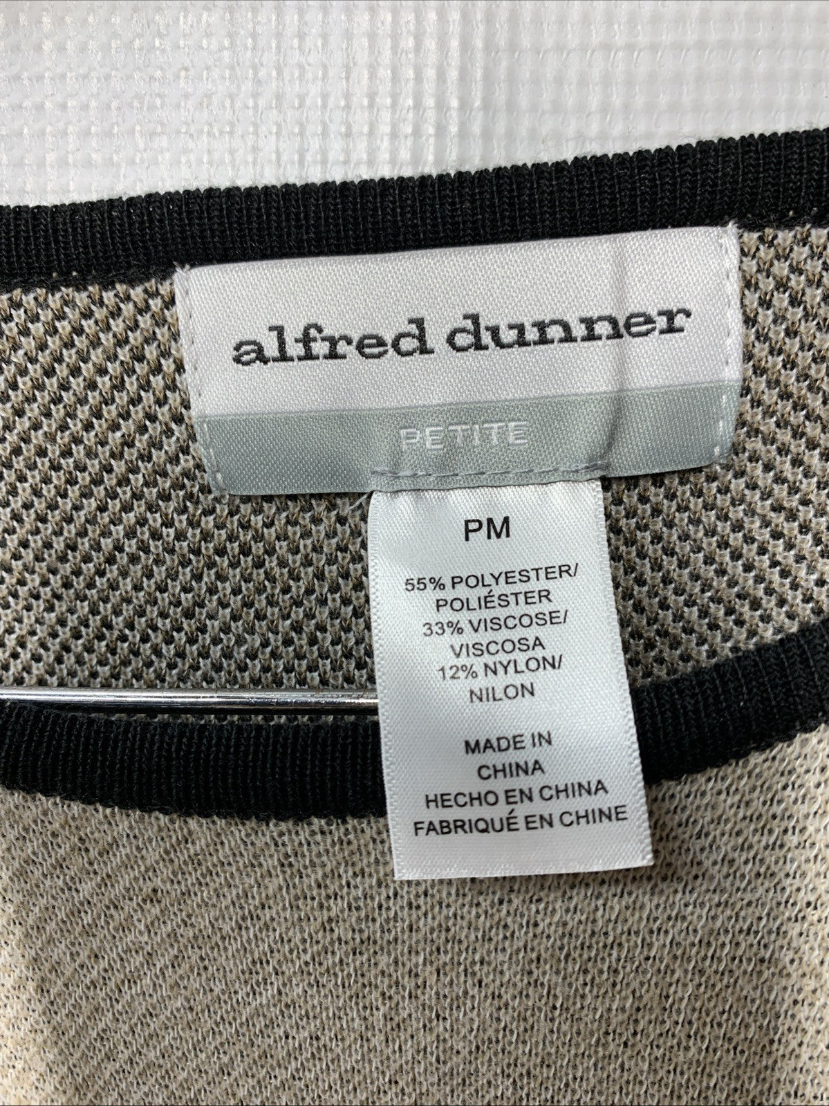 Alfred Dunner women's animal jacquard crew neck sweater with long sleeves, featuring a classic design in soft knit fabric.
