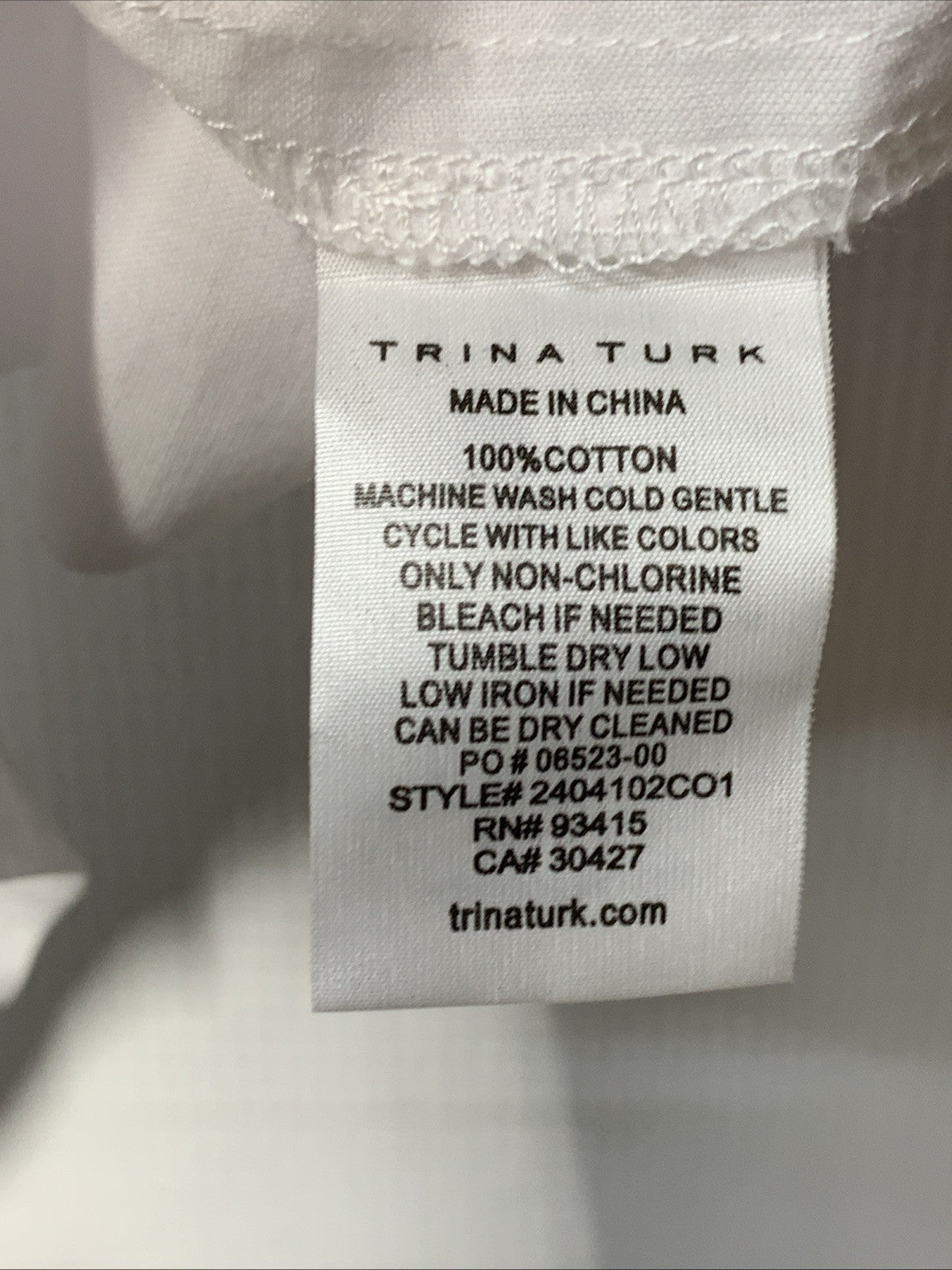 White Trina Turk women's Soraveta sleeveless top with string tie, small size, casual styled women's clothing.