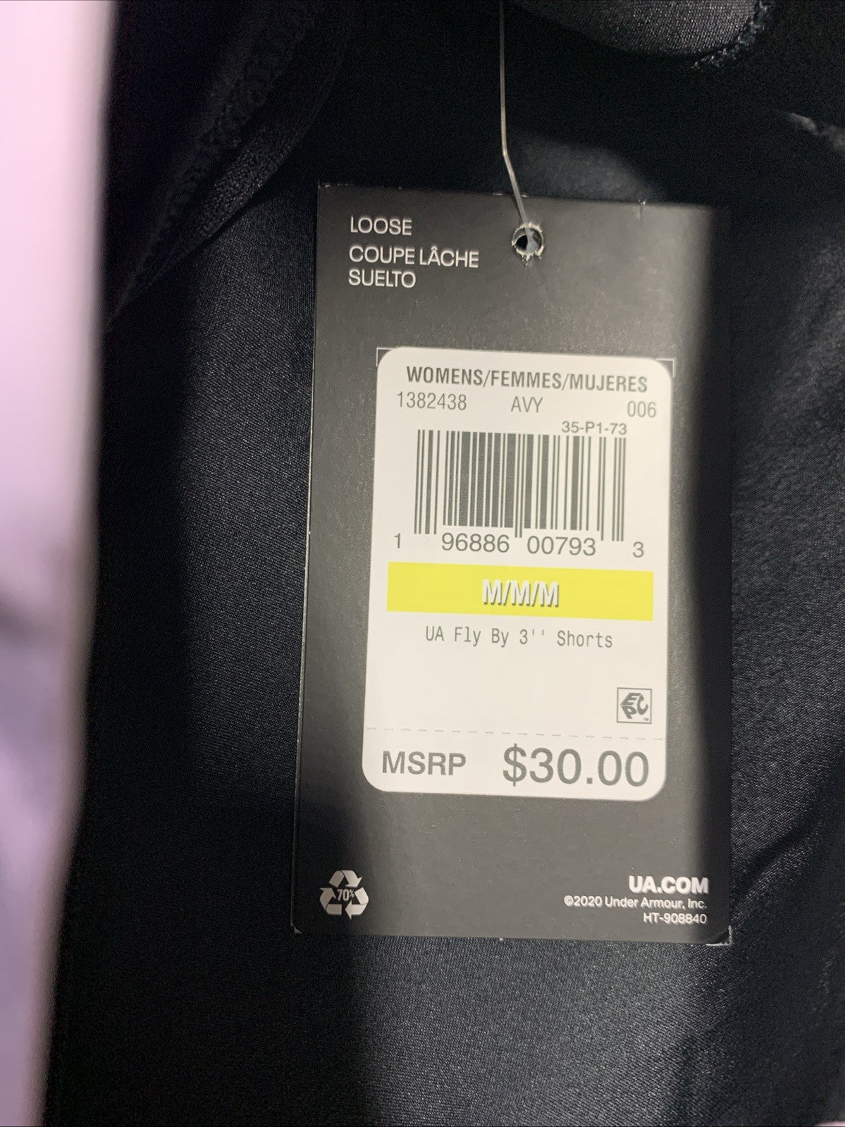 Under Armor women's Fly By lined loose running shorts in black and lavender, size M, shown on a hanger.