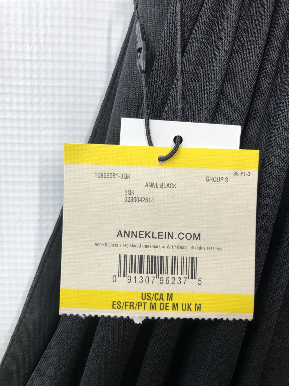 Black Anne Klein midi sleeveless dress with V-neck and empire waist, size medium, from The Family Flips, perfect for elegant occasions.