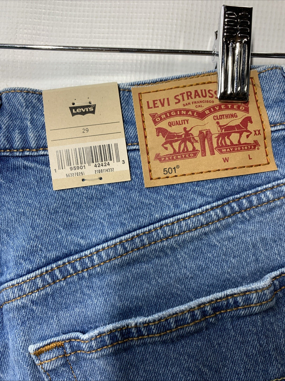 Levi's women's 501 high rise distressed denim shorts in size 29, casual style, with frayed edges and classic fit.