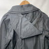 London Fog women's black trench coat with long sleeves, hood, and pockets, shown hanging or styled on a model.