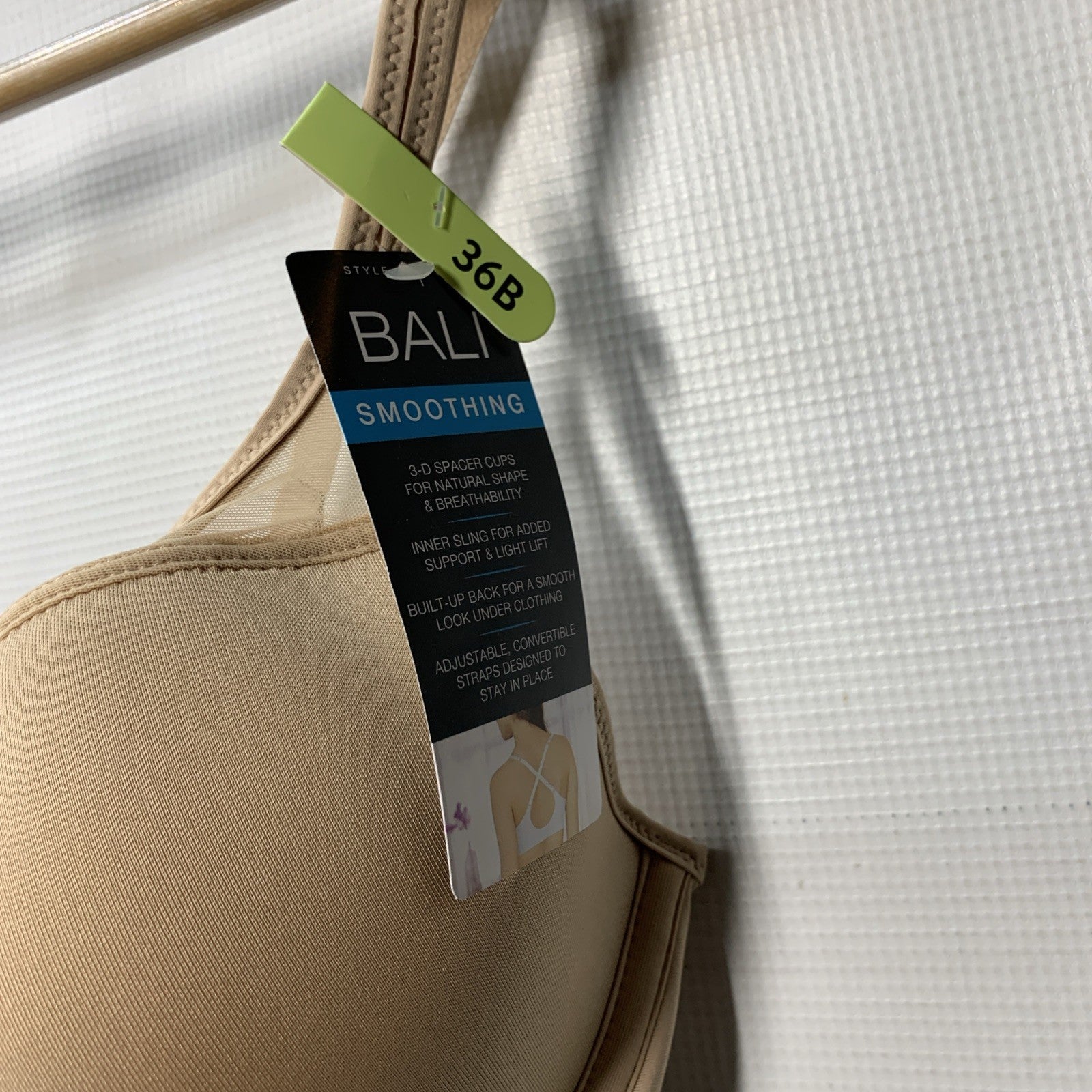 Women's One Smooth U Ultra Light Nude Bra with illusion neckline, size 36B, by The Family Flips, shown on a model.