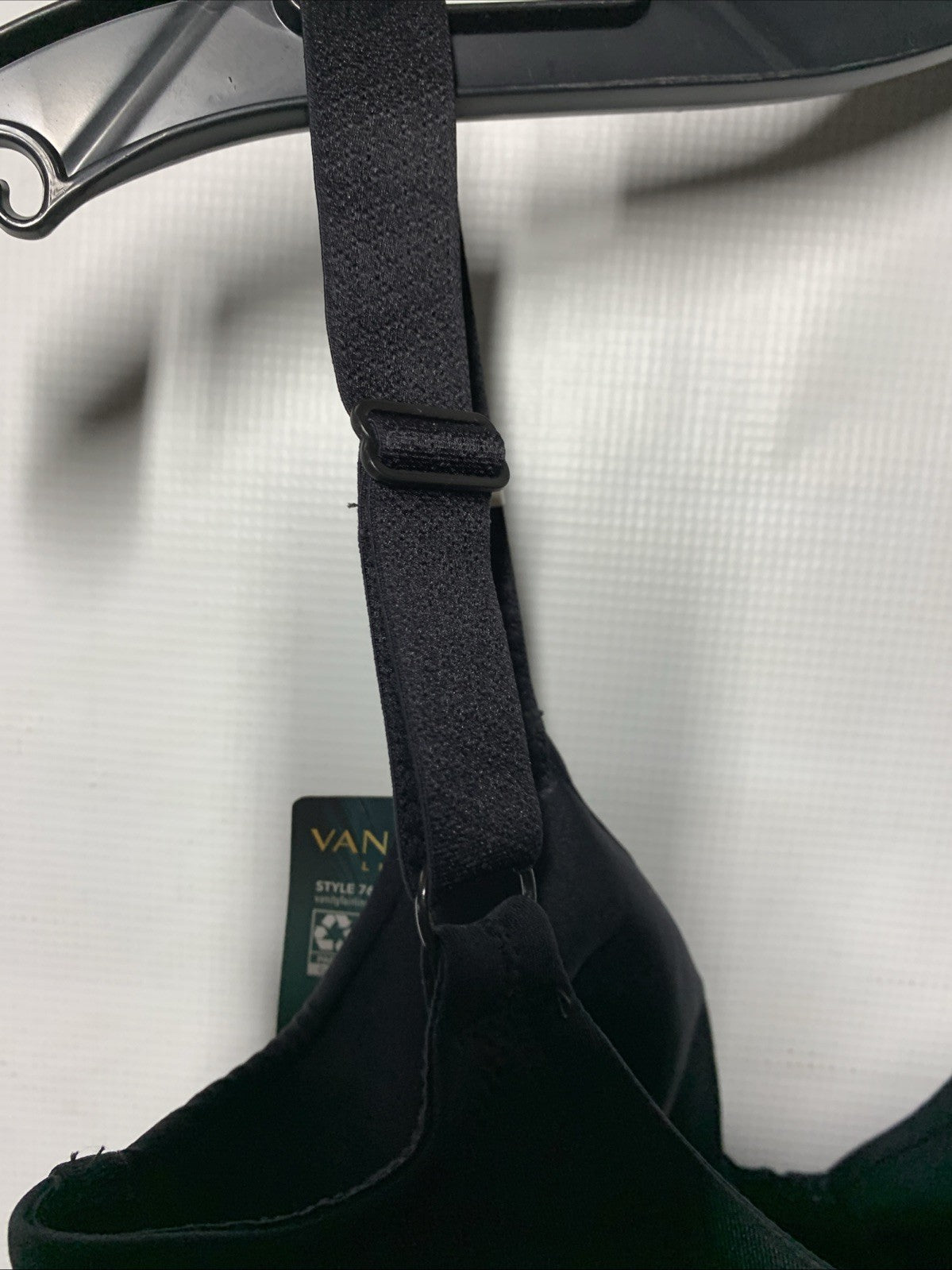 Black Vanity Fair 76080 women's underwire minimizer bra in 36H with back smoothing design, offering support and comfort.