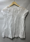 White sleeveless Soraveta top for women by Trina Turk, size small, with string tie detail.