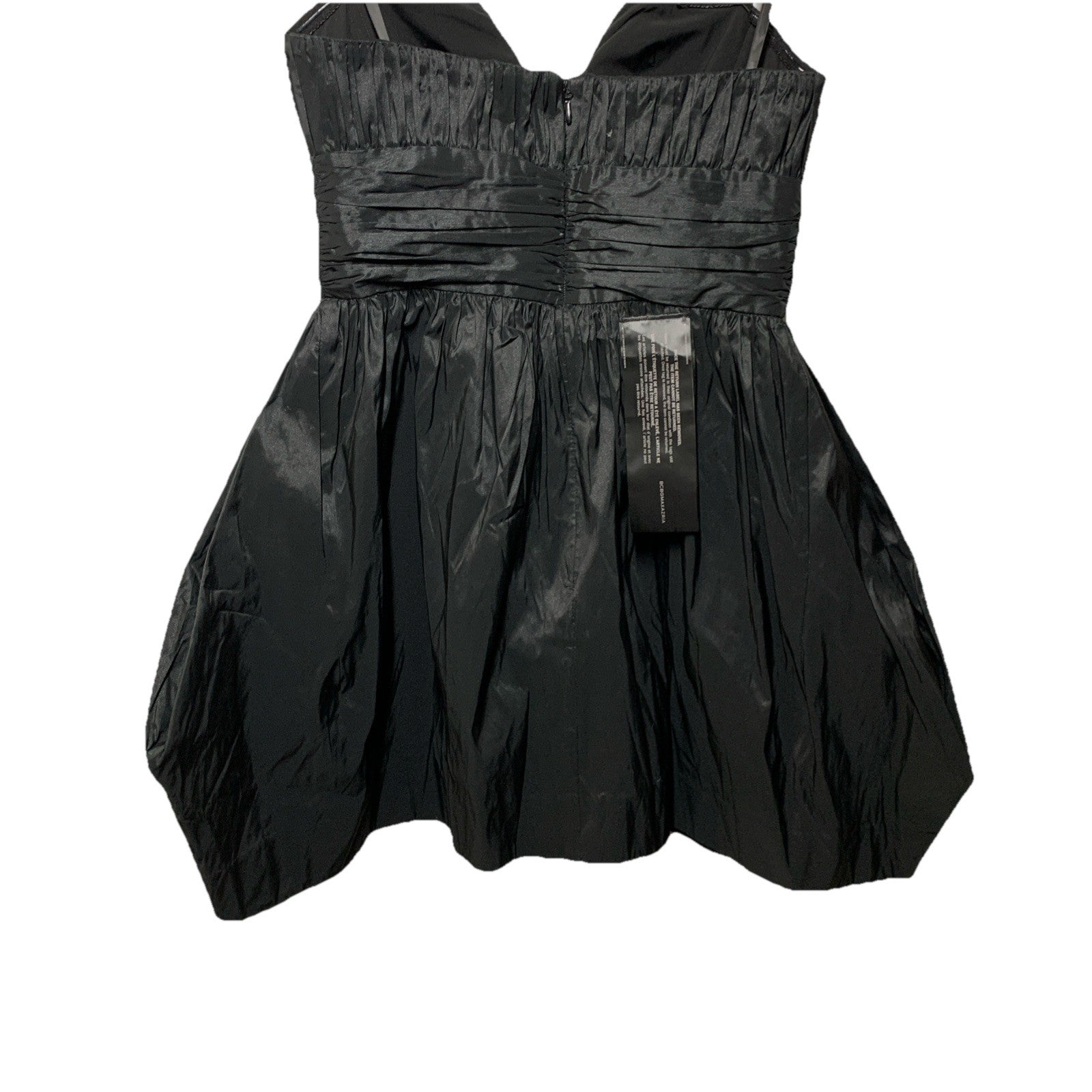 Black strapless mini evening dress by BCBGMAXAZRIA with ruched detailing, size 6, for women’s elegant occasion wear.
