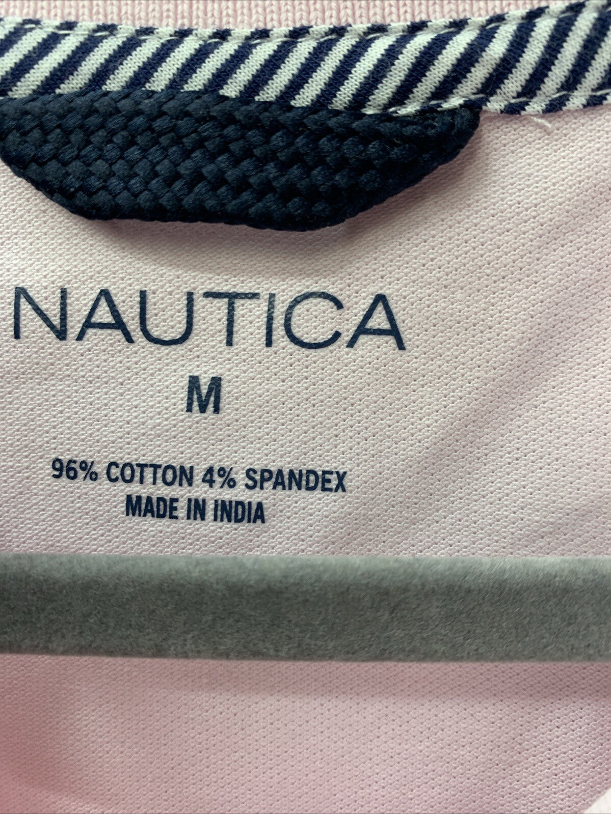Nautica women's pink short sleeve cotton polo shirt with 5 buttons, size M, from The Family Flips, featuring a classic polo design.