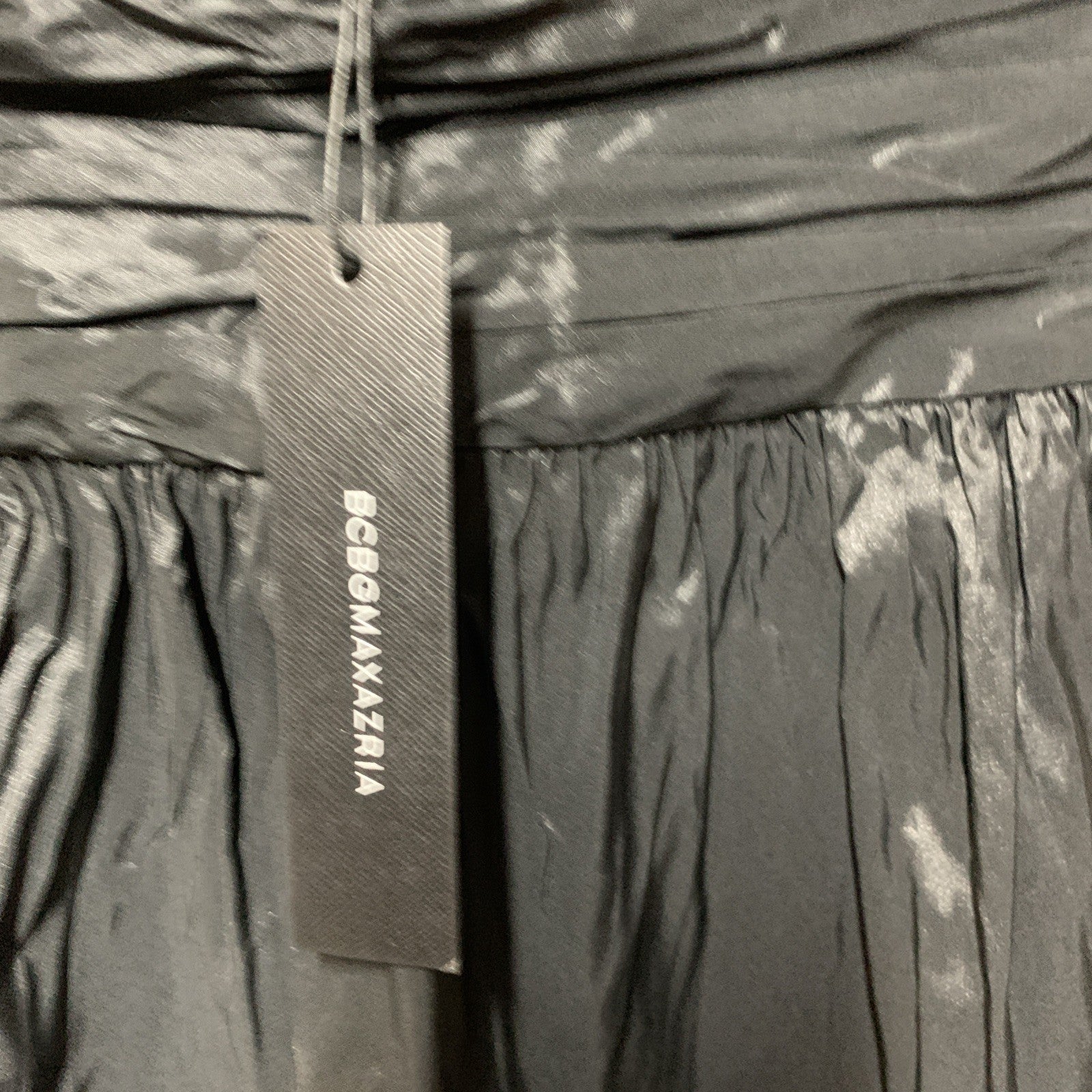 Black BCBGMAXAZRIA women’s strapless mini dress with ruched detailing, perfect for evening wear, size 6.