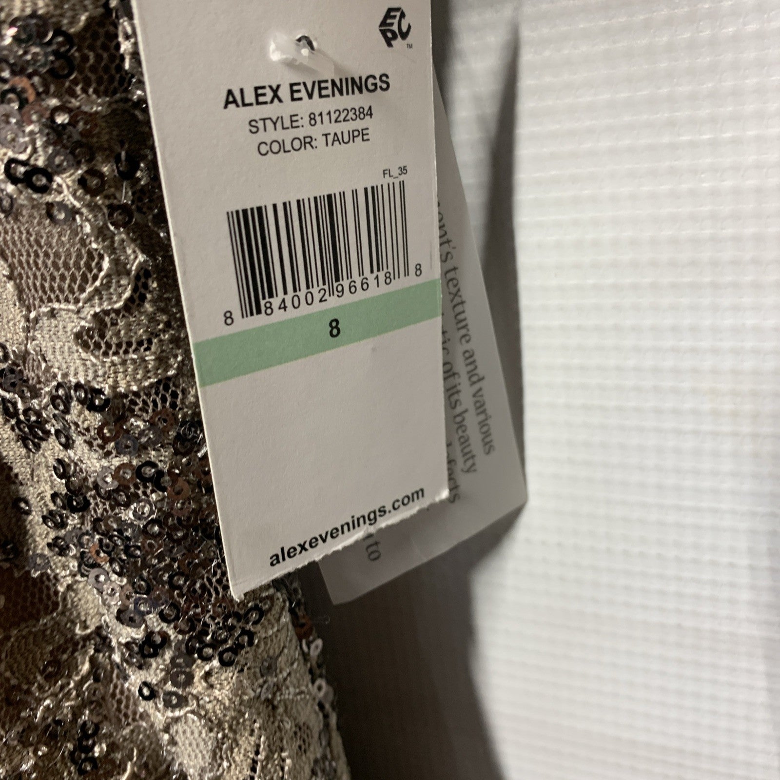 Taupe long rosette mother of the bride dress by Alex Evenings, featuring elegant floral details and a fitted silhouette.